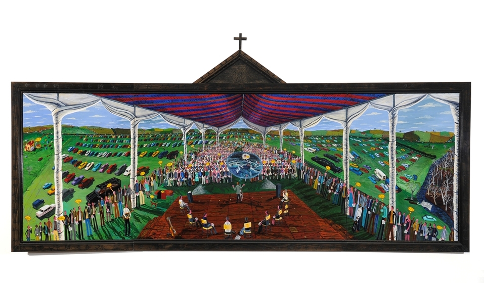 Colourful painting of a large crowd of people standing under a red and blue marque, in the foreground is a timber stage with a person standing centre, surrounded by a half circle of seated people. In the background behind the marque are rows of parked cars. The painting is surrounded by a timber frame with a triangle topped with a crucifix on top. 