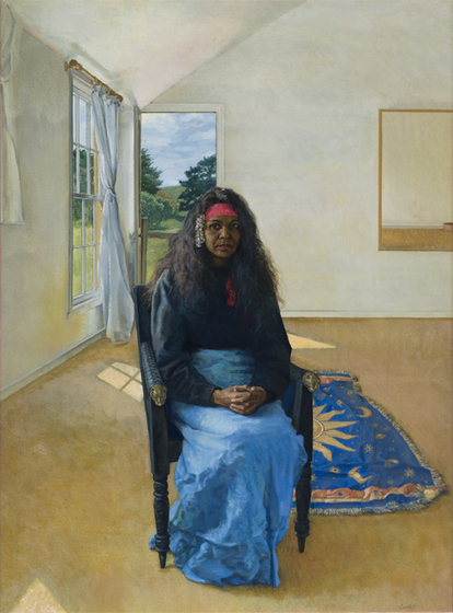 Painting of a woman in a bue skirt, black top and wearing a red bandana, seated in a room. There is a rug on the floor behind featuring the sun centre, surrounded by blue, stars and a moon.