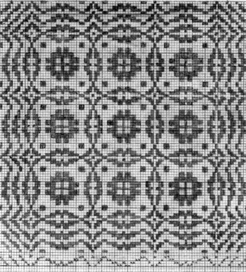 Geometric fabric pattern, made from repeating circles and small squares.
