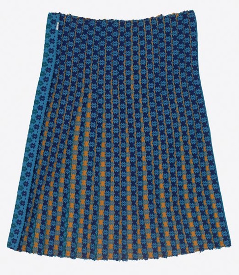 Length of blue fabric with a tight lined pattern and yellow detail underneath.