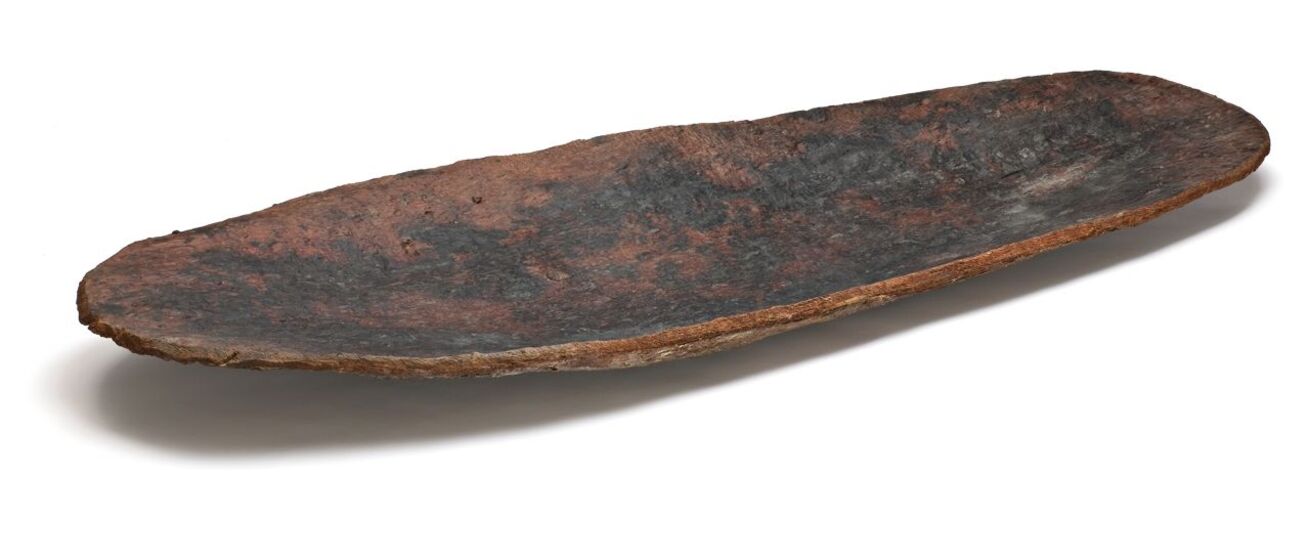 Lightly curved and shallow small wooden canoe. 