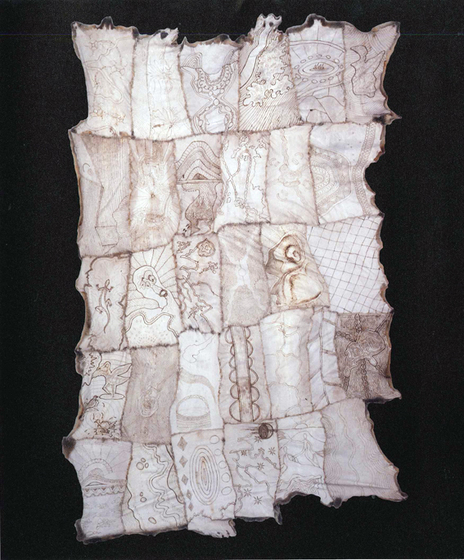 Cloak made with possum skin, stitched together in panels with each featuring a different design.