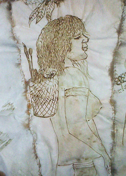 Close up of a panel from a possum skin cloak, showing a woman with a basket on her back. 