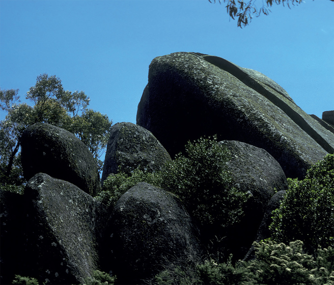 large granite boulders protrude from the land