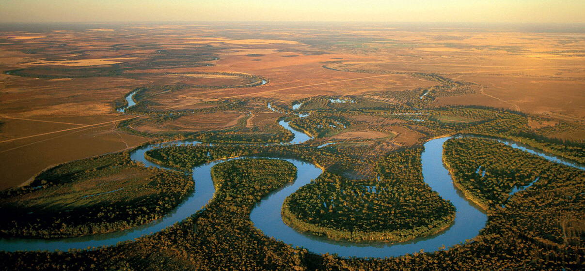 a river bends through a flood plain