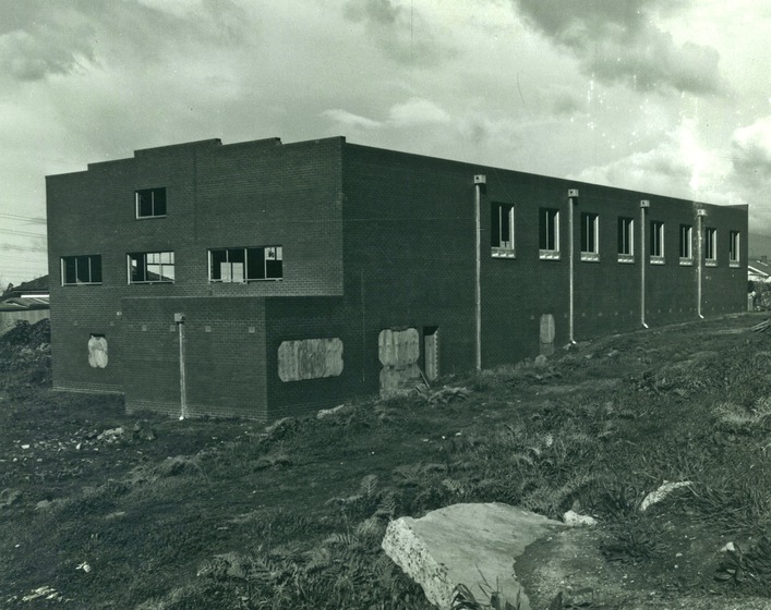 Exterior of a large hall under construction