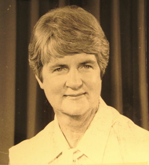 Sepia photograph of short haired woman