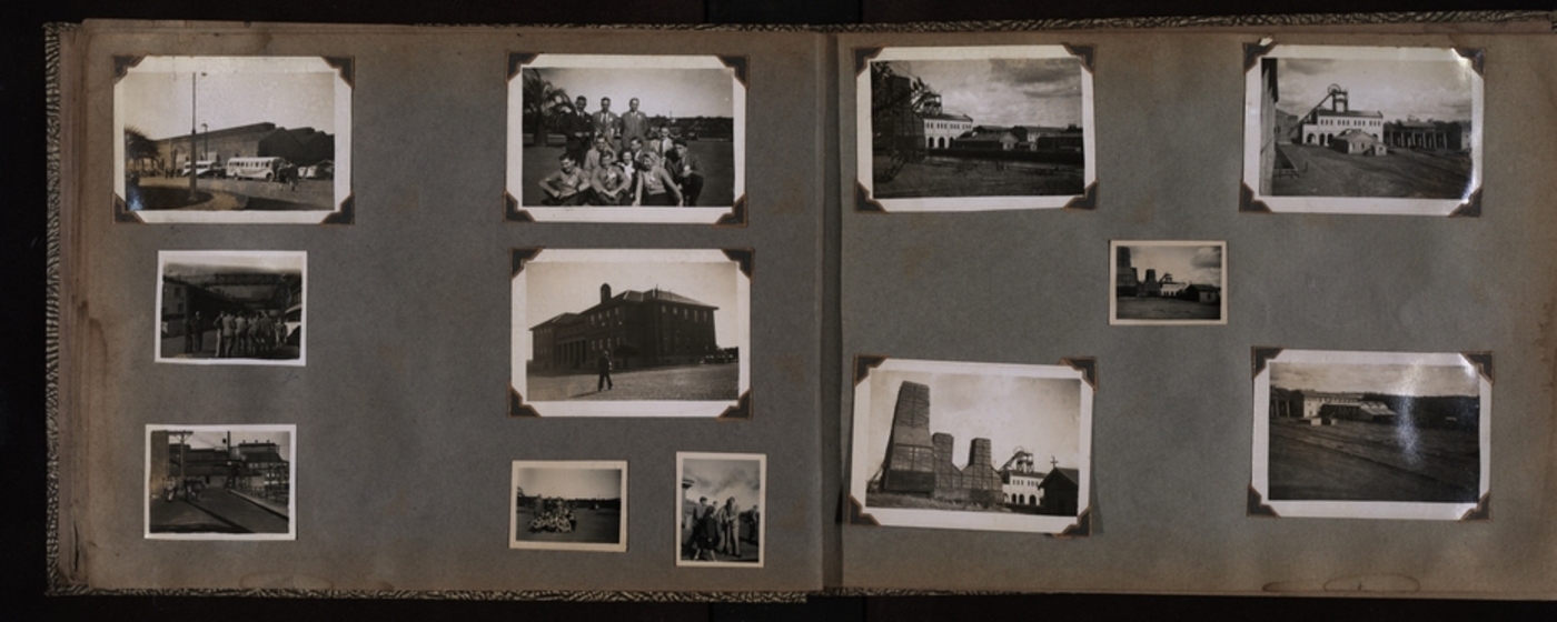 Photograph of an old photo album with black and white photos 