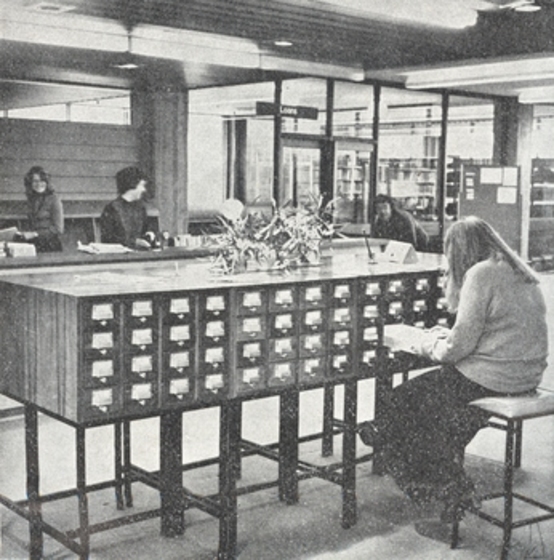 black and white photograph in a library